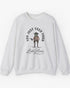 Flat laying ash gray 'You Just Yeed Your Last Haw' sweatshirt with a funny retro cowboy frog graphic